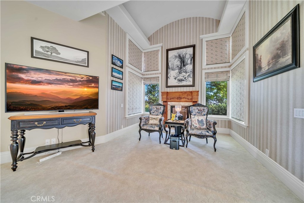 43744 Calle De Velardo Temecula, CA 92592 - Photo 24 of 60 a living room with furniture and a flat screen tv