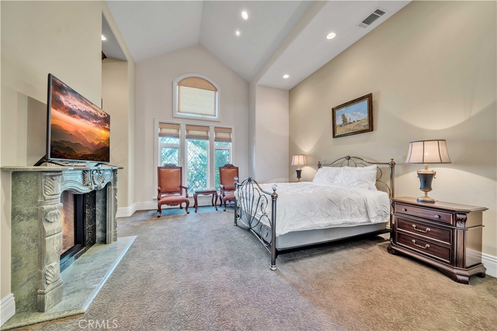 43744 Calle De Velardo Temecula, CA 92592 - Photo 26 of 60 a bedroom with a bed and a flat screen tv