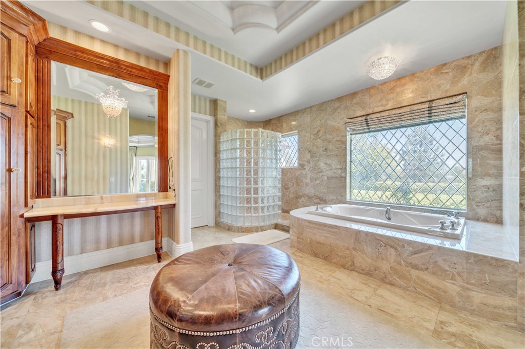 43744 Calle De Velardo Temecula, CA 92592 - Photo 35 of 60 a room with a large window and tub