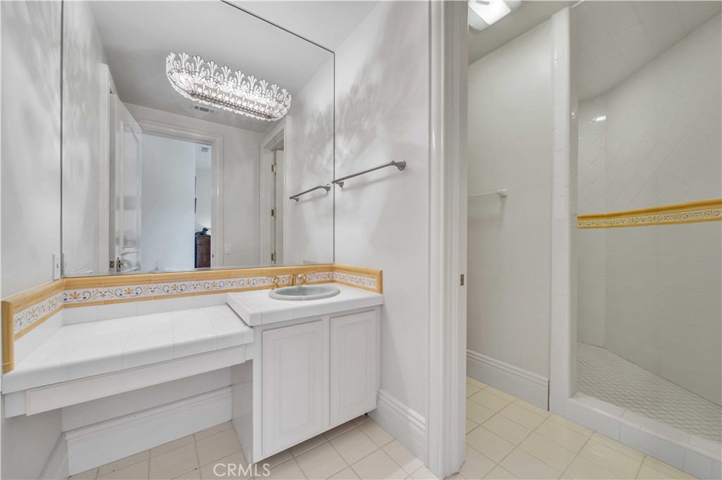 43744 Calle De Velardo Temecula, CA 92592 - Photo 36 of 60 a bathroom with a sink and a mirror