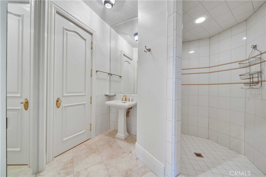 43744 Calle De Velardo Temecula, CA 92592 - Photo 37 of 60 a bathroom with a shower and a sink