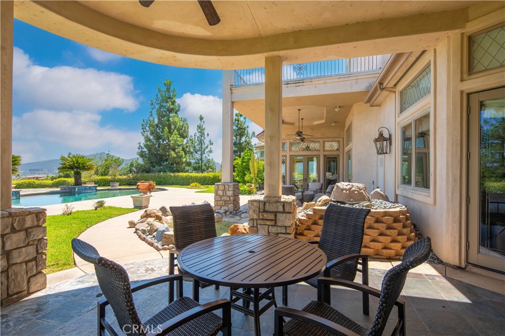 43744 Calle De Velardo Temecula, CA 92592 - Photo 43 of 60 a outdoor dining space with furniture and garden view