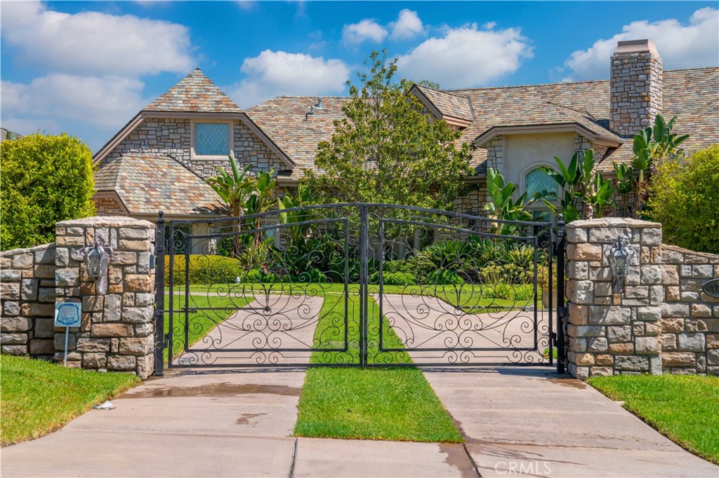 43744 Calle De Velardo Temecula, CA 92592 - Photo 50 of 60 a front view of a house with a garden