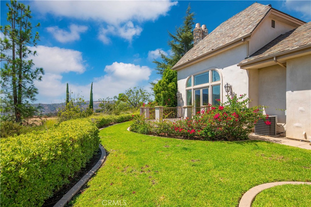 43744 Calle De Velardo Temecula, CA 92592 - Photo 55 of 60 a view of a house with backyard and garden