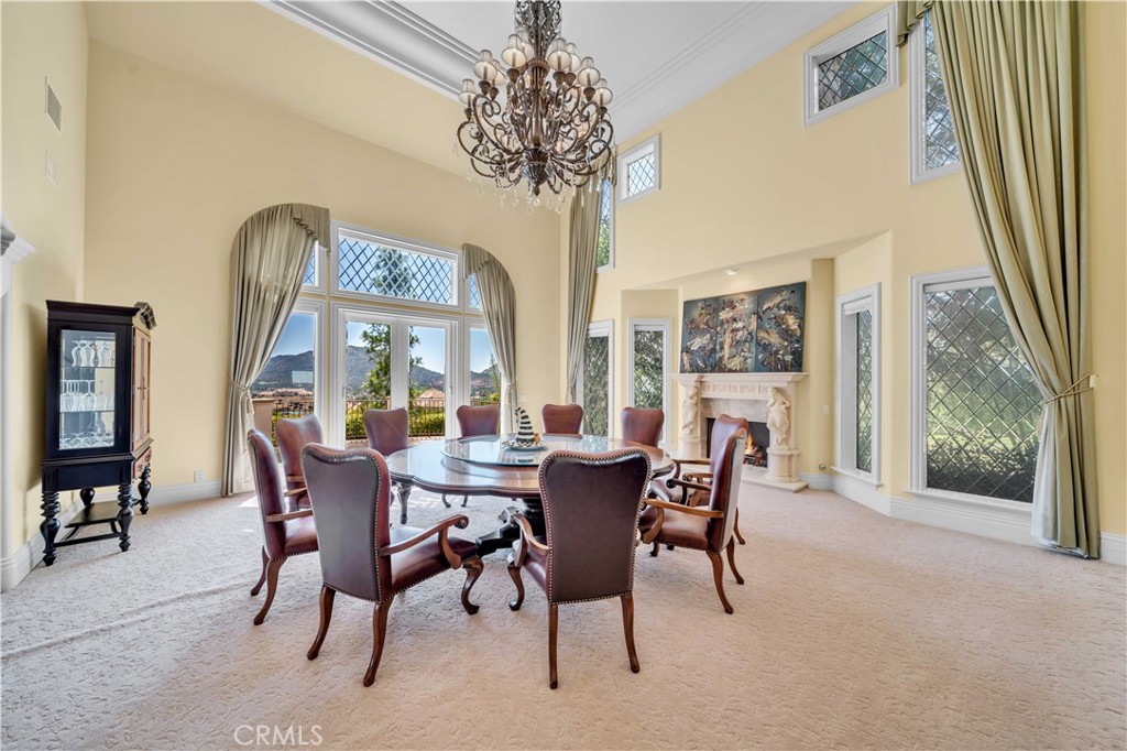 43744 Calle De Velardo Temecula, CA 92592 - Photo 7 of 60 a dining room with furniture a chandelier and wooden floor