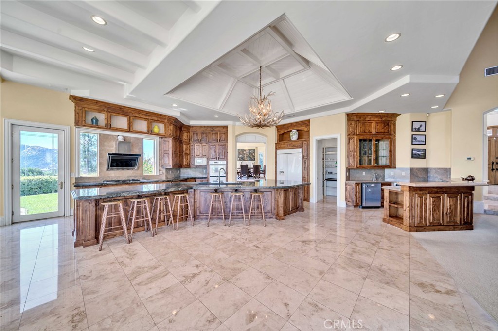 43744 Calle De Velardo Temecula, CA 92592 - Photo 9 of 60 a living room with furniture and flat screen tv