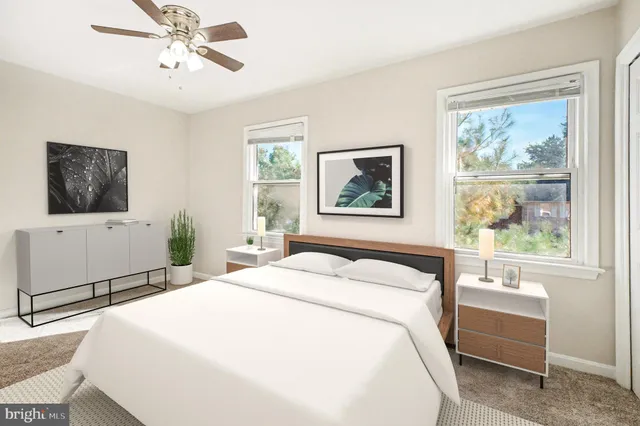 a bedroom with a large bed and a window