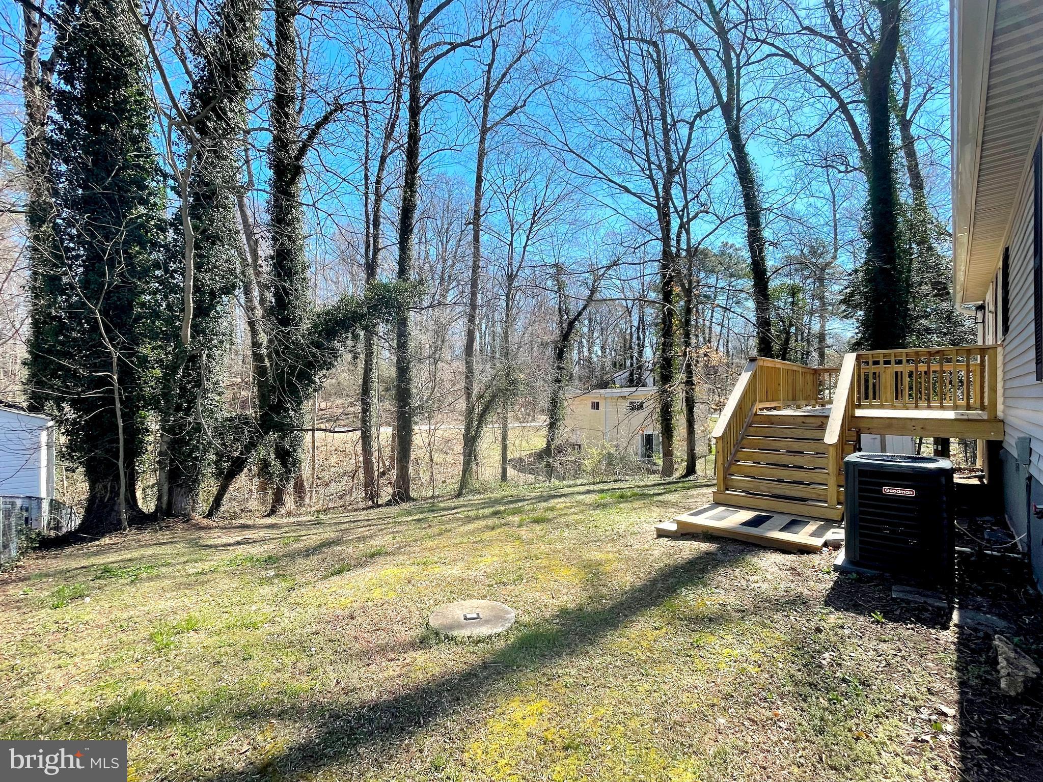 8264 Sycamore Road Lusby, MD 20657 - Photo 19 of 30 Fenced rear yard backing to wooded privac