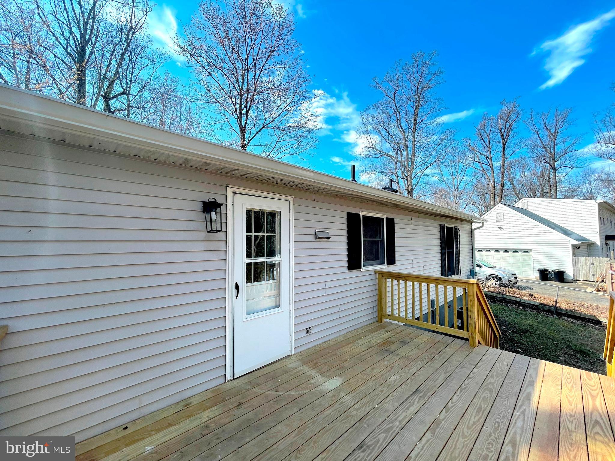 8264 Sycamore Road Lusby, MD 20657 - Photo 20 of 30 Rear deck off of dining room