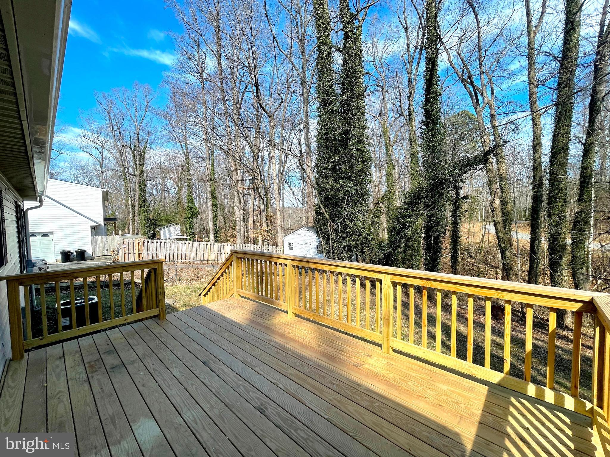 8264 Sycamore Road Lusby, MD 20657 - Photo 21 of 30 Deck overlooks fenced rear yard