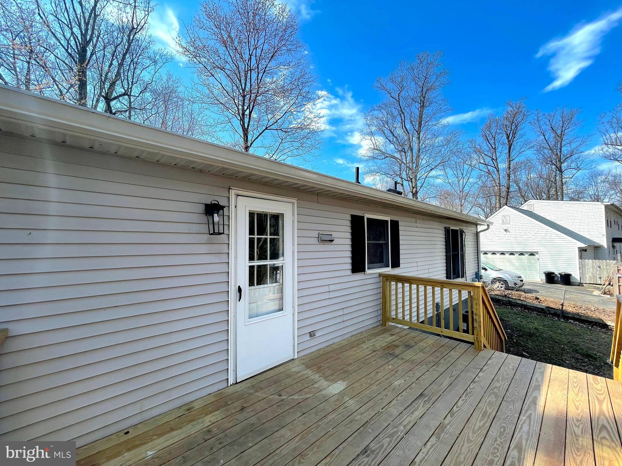 8264 Sycamore Road Lusby, MD 20657 - Photo 22 of 25 Rear deck off of dining room