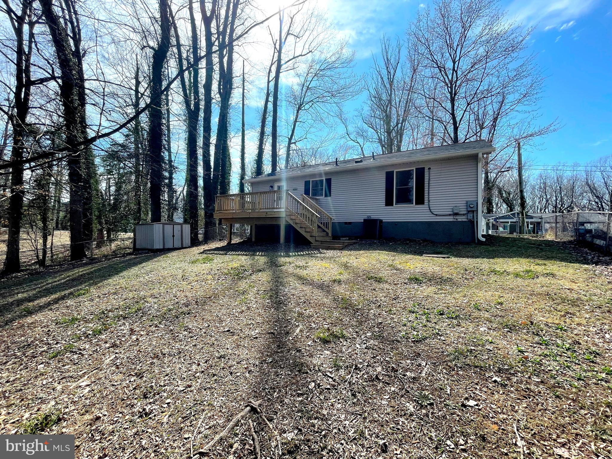 8264 Sycamore Road Lusby, MD 20657 - Photo 23 of 25 Fenced rear yard backing to wooded privacy