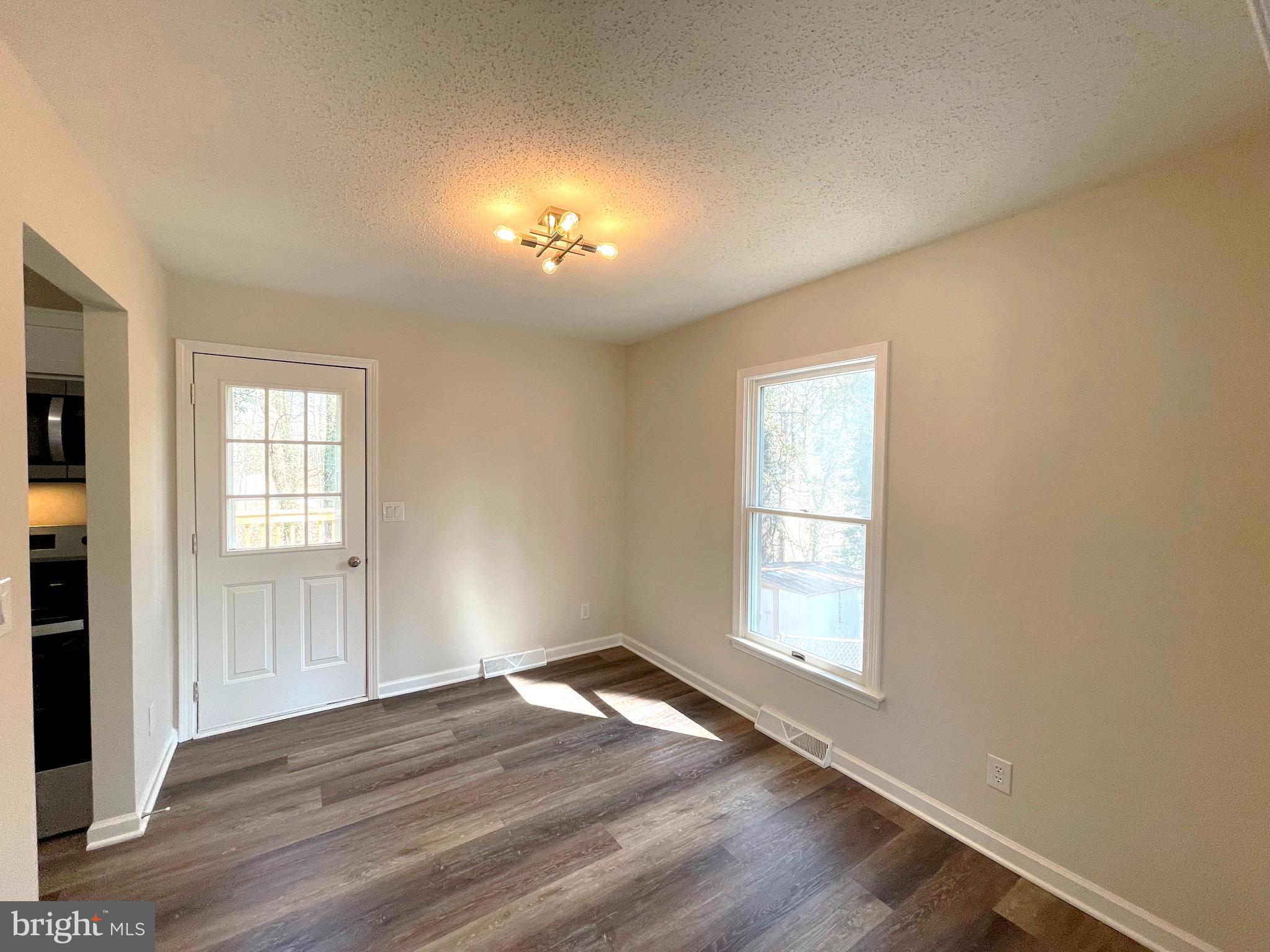 8264 Sycamore Road Lusby, MD 20657 - Photo 7 of 25 Dining room w/door leading to rear deck