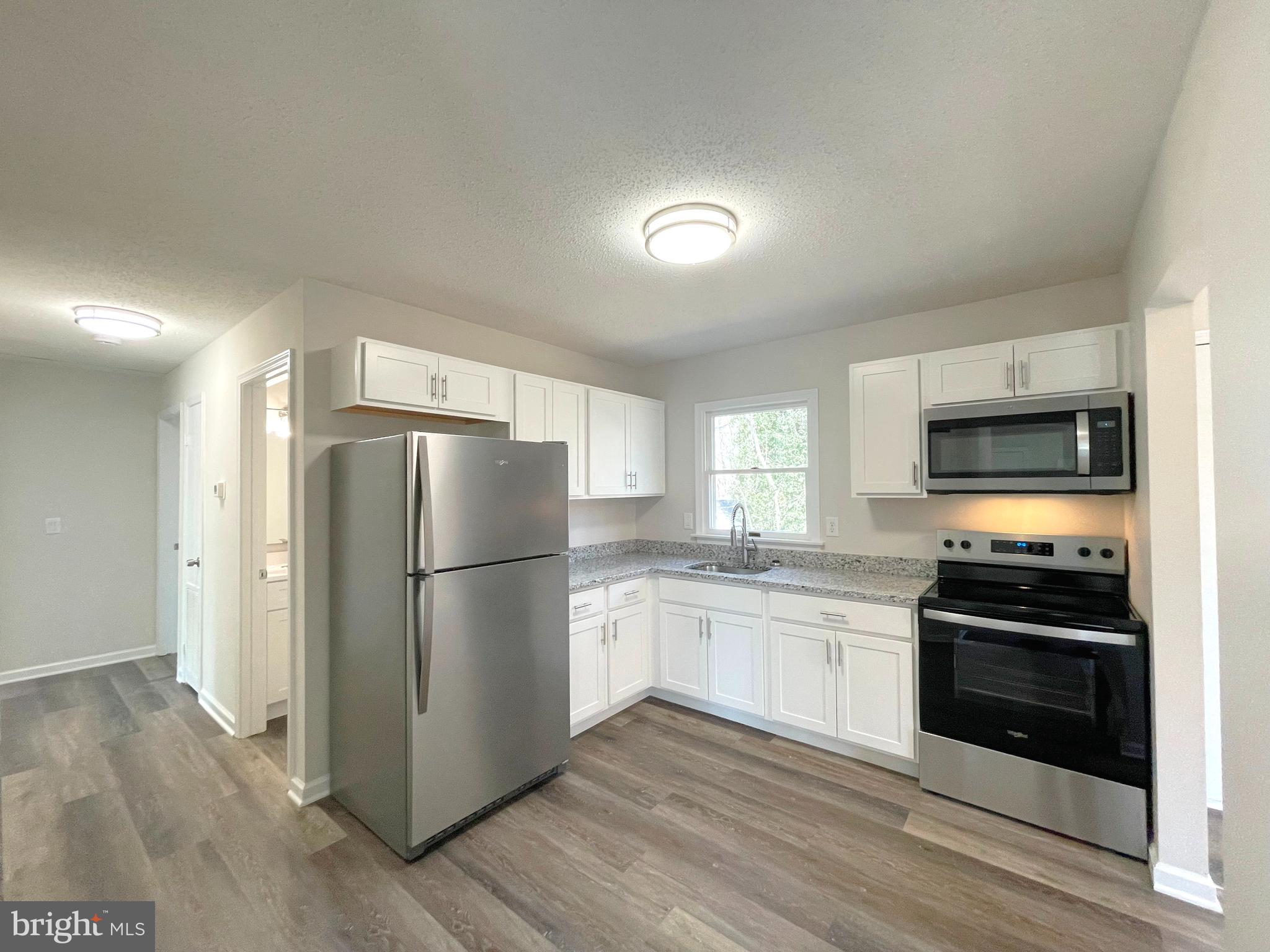 8264 Sycamore Road Lusby, MD 20657 - Photo 8 of 25 Kitchen w/stainless steel appliances
