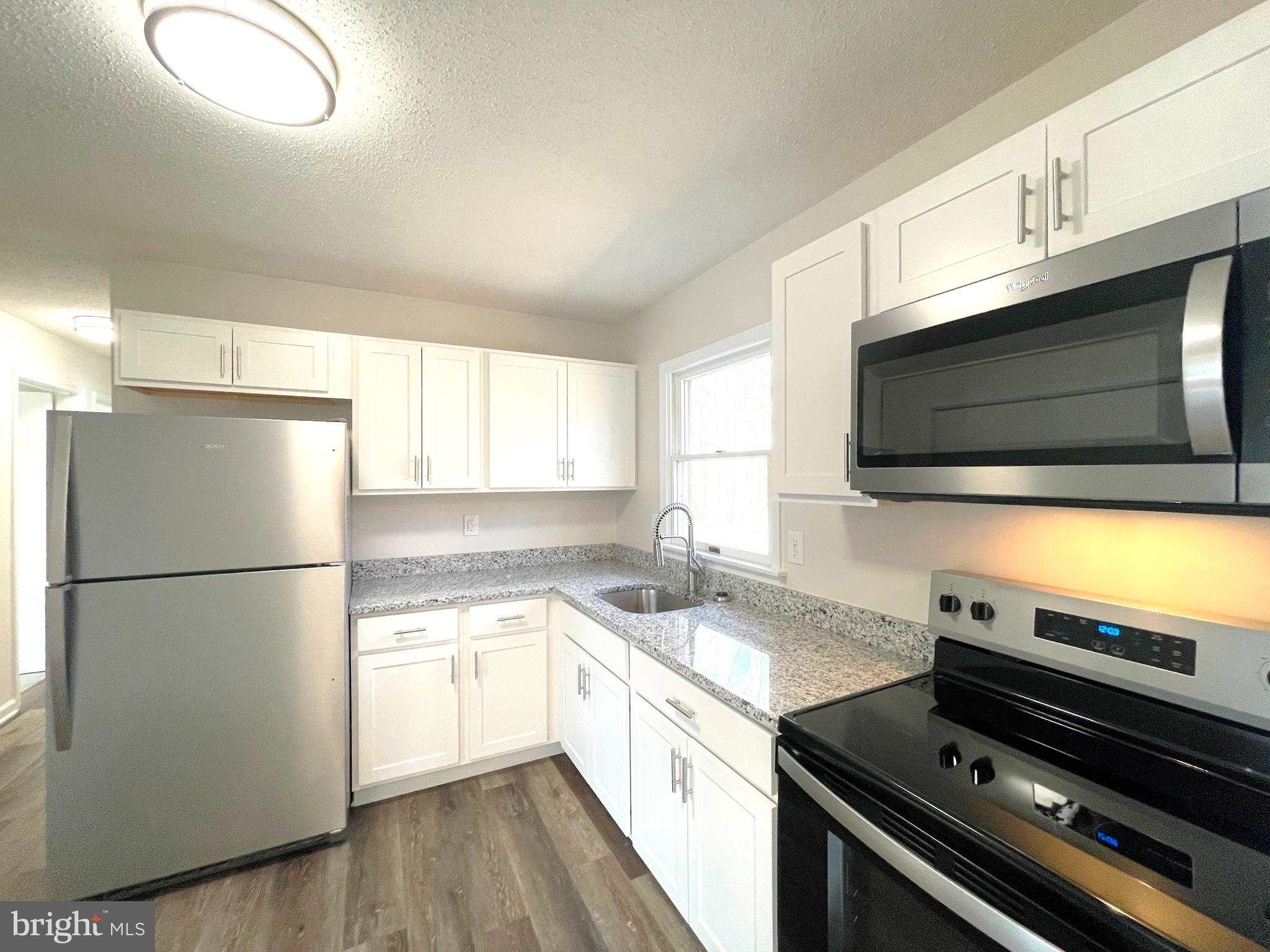 8264 Sycamore Road Lusby, MD 20657 - Photo 9 of 25 Kitchen w/stainless steel appliances