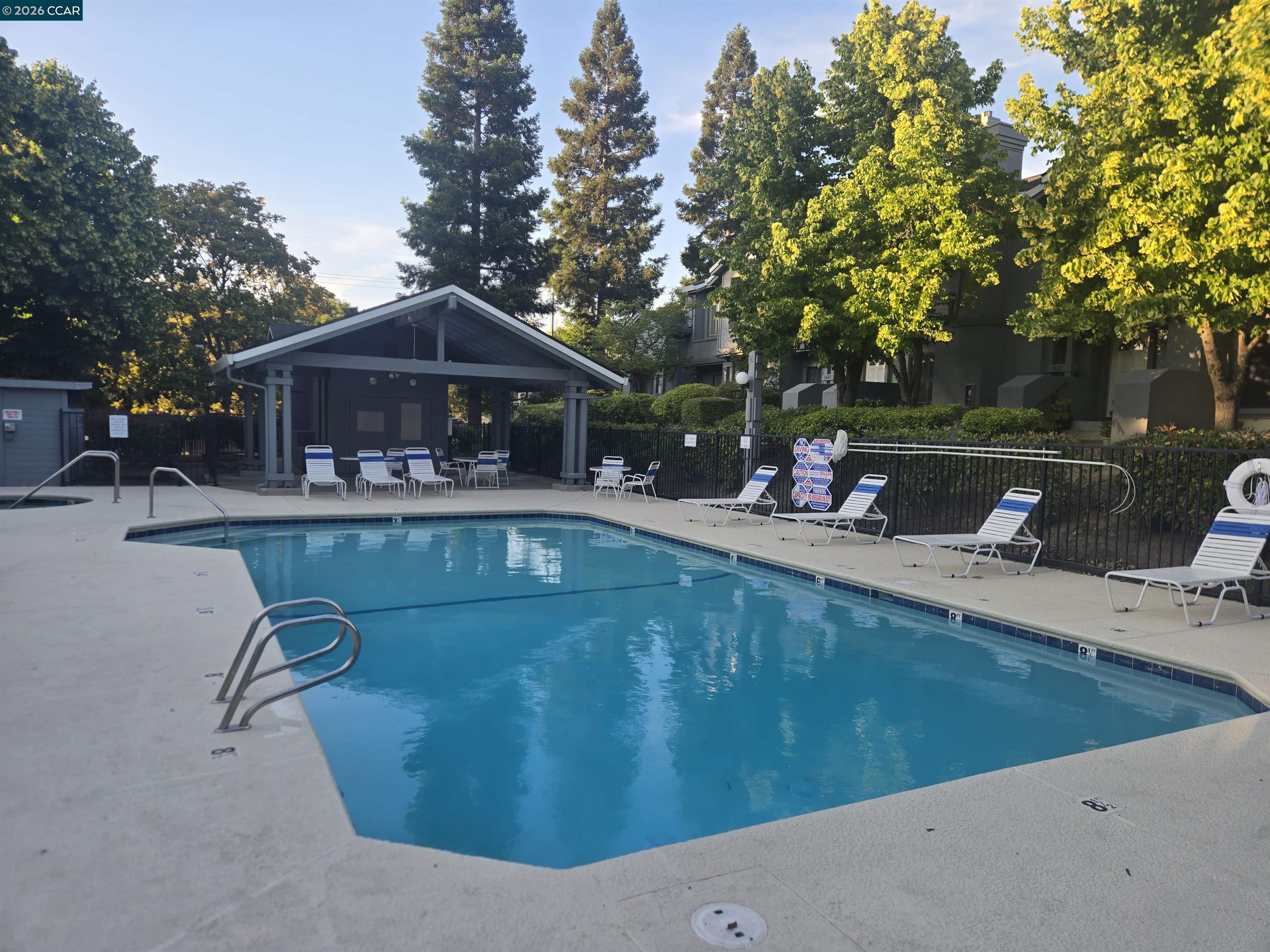 1707 Geary Road Walnut Creek, CA 94597 - Photo 32 of 43 a view of a house with pool porch and chairs
