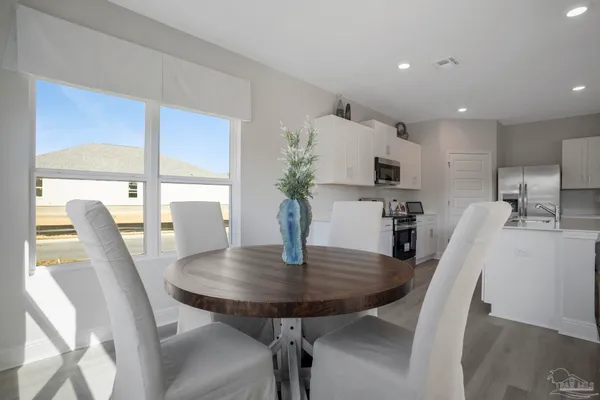 a bathroom with a double vanity sink mirror and shower