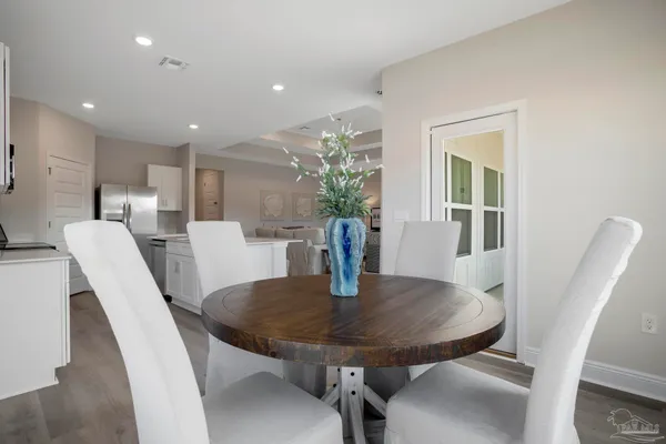 a bedroom with a bed and painting on the wall