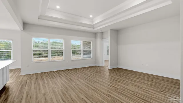 a kitchen with a sink and large window