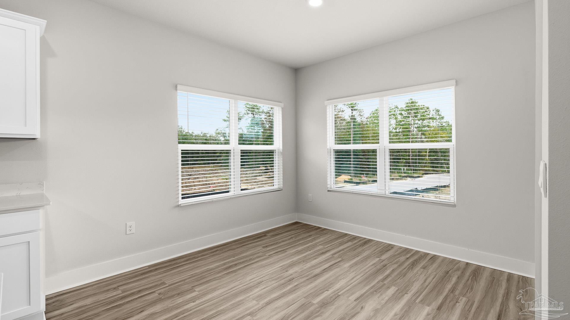 2800 Water Birch Road Cantonment, FL 32533 - Photo 28 of 37 a view of an empty room with wooden floor and a window