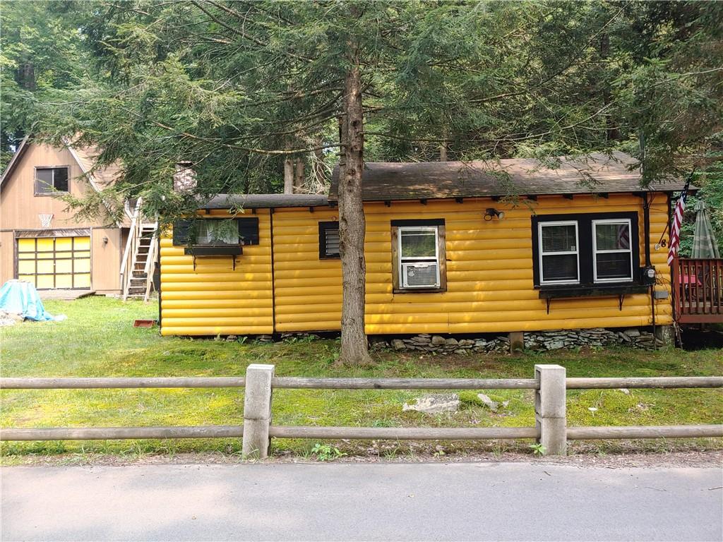8 Brookside Way Smallwood, NY 12778 - Photo 1 of 1 a view of a house with a yard and wooden fence