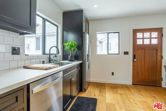a kitchen with a sink and cabinets