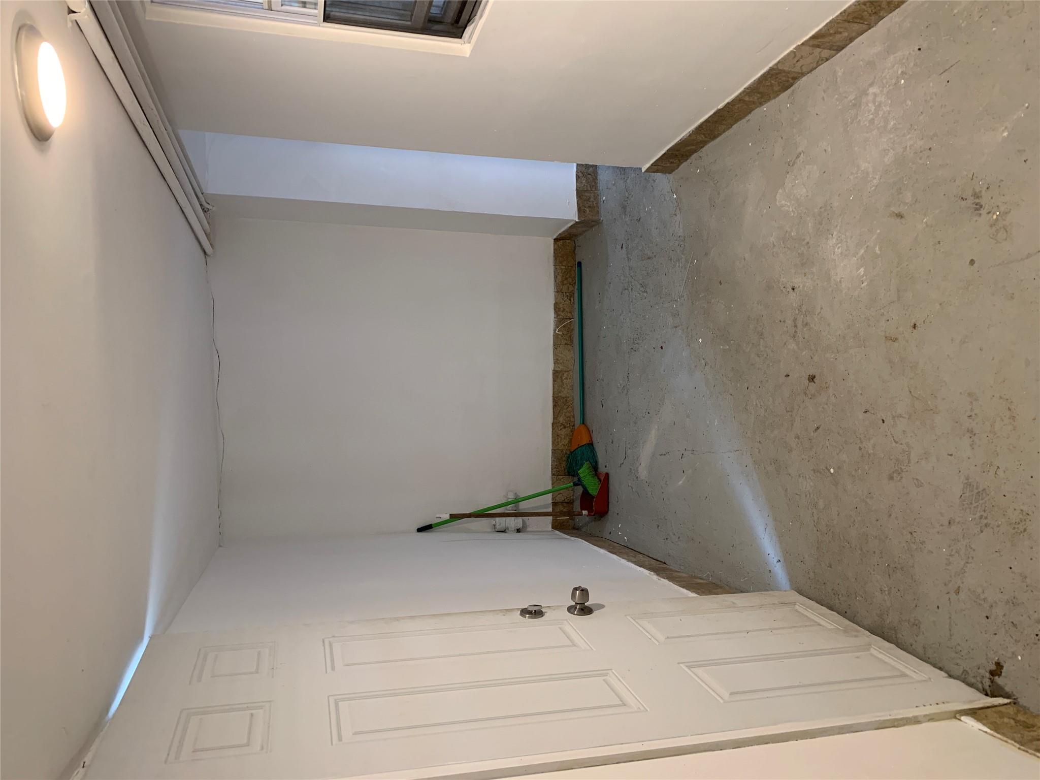 2263 Ryer Avenue Bronx, NY 10457 - Photo 21 of 49 Spare room with concrete floors and baseboards