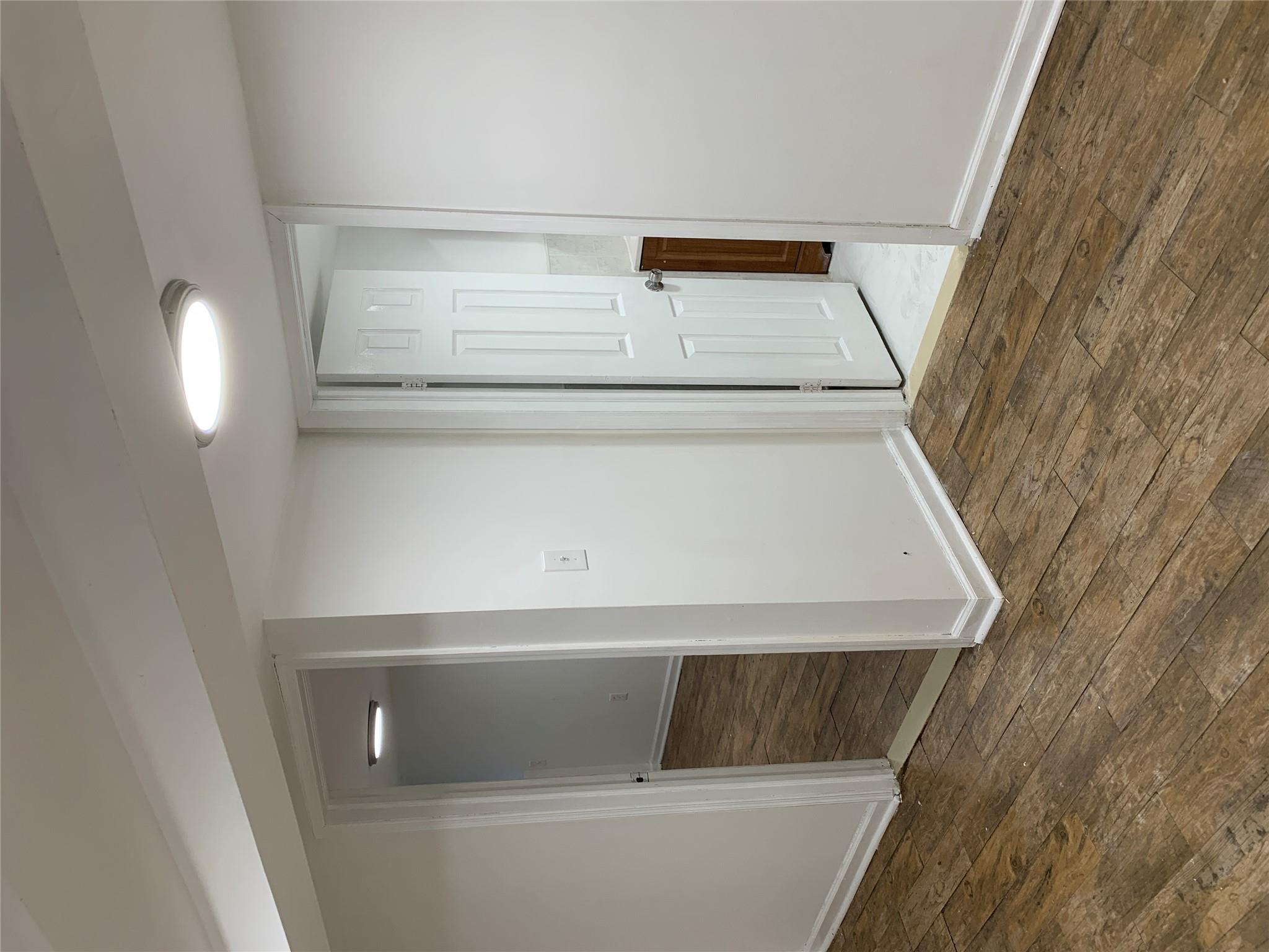 2263 Ryer Avenue Bronx, NY 10457 - Photo 24 of 49 Spare room with baseboards and hardwood / wood-style floors