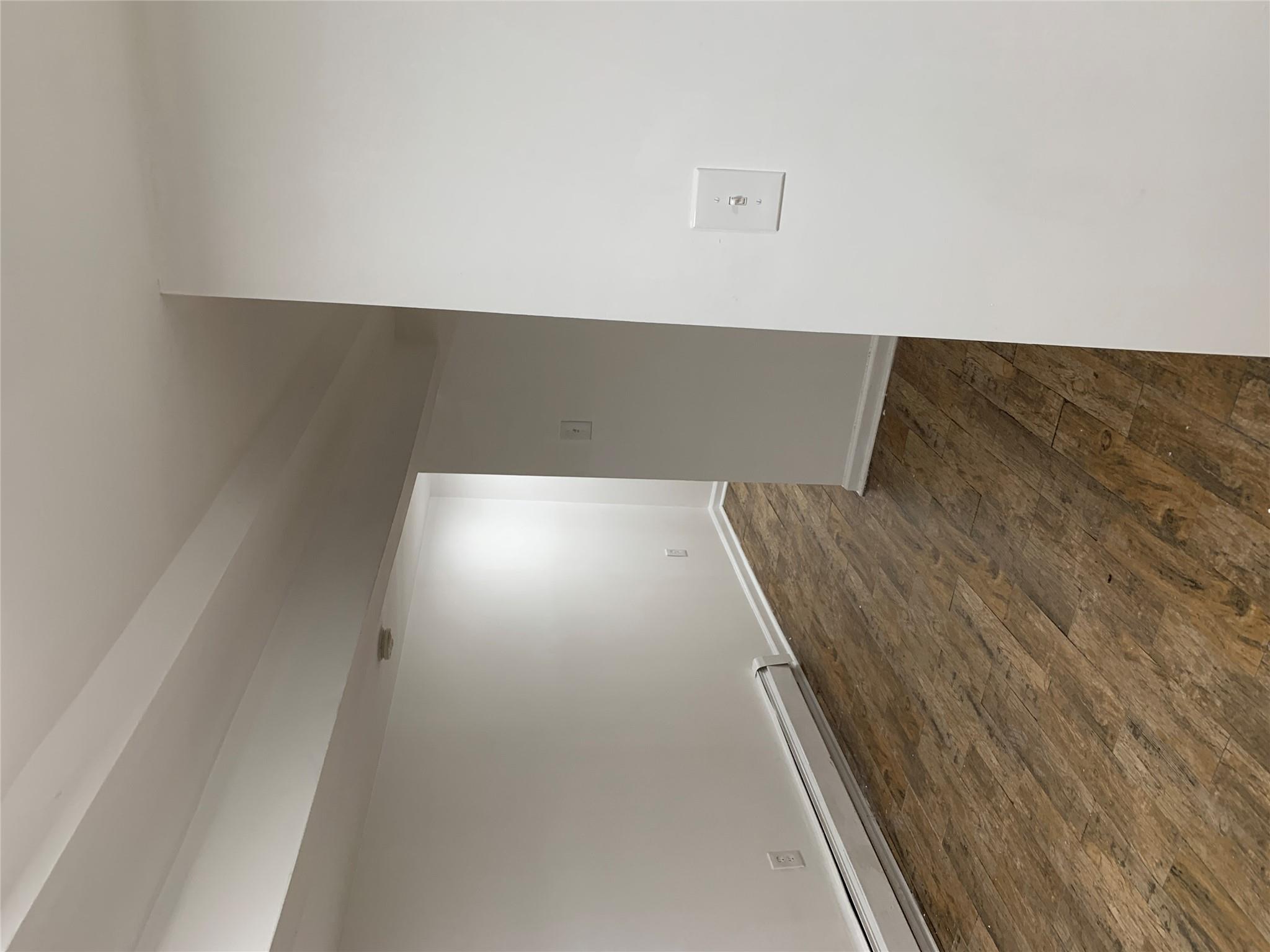 2263 Ryer Avenue Bronx, NY 10457 - Photo 26 of 49 Spare room with dark wood-style floors, a baseboard radiator, and baseboards