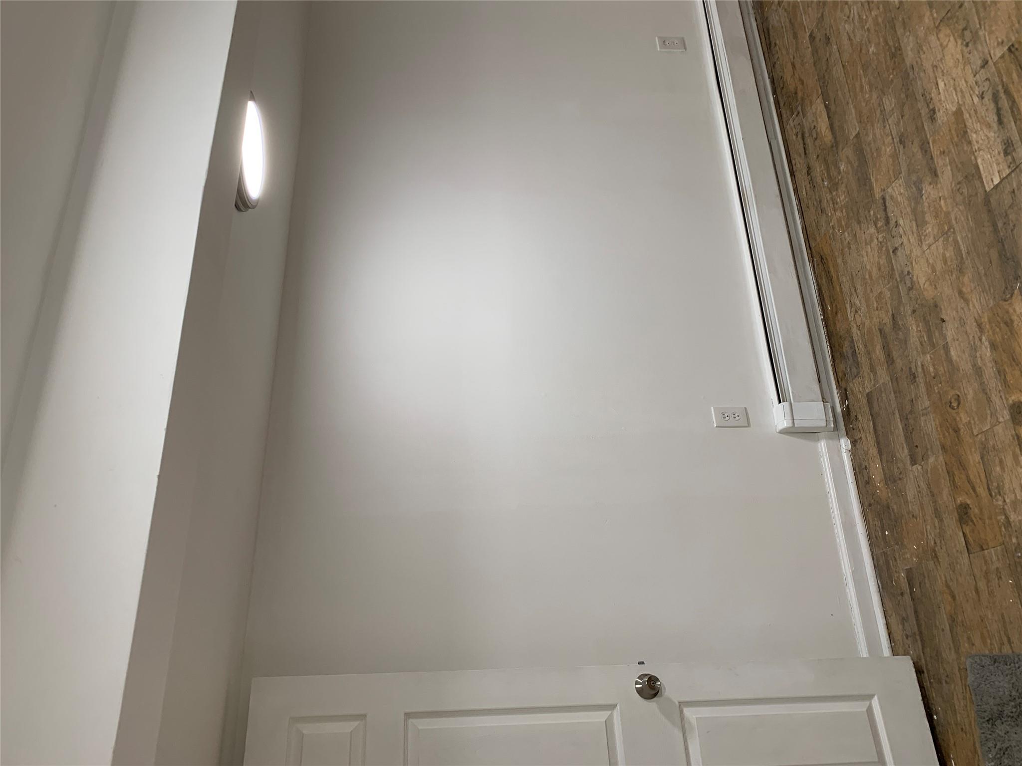 2263 Ryer Avenue Bronx, NY 10457 - Photo 27 of 49 Empty room featuring dark wood finished floors, a baseboard radiator, and baseboards