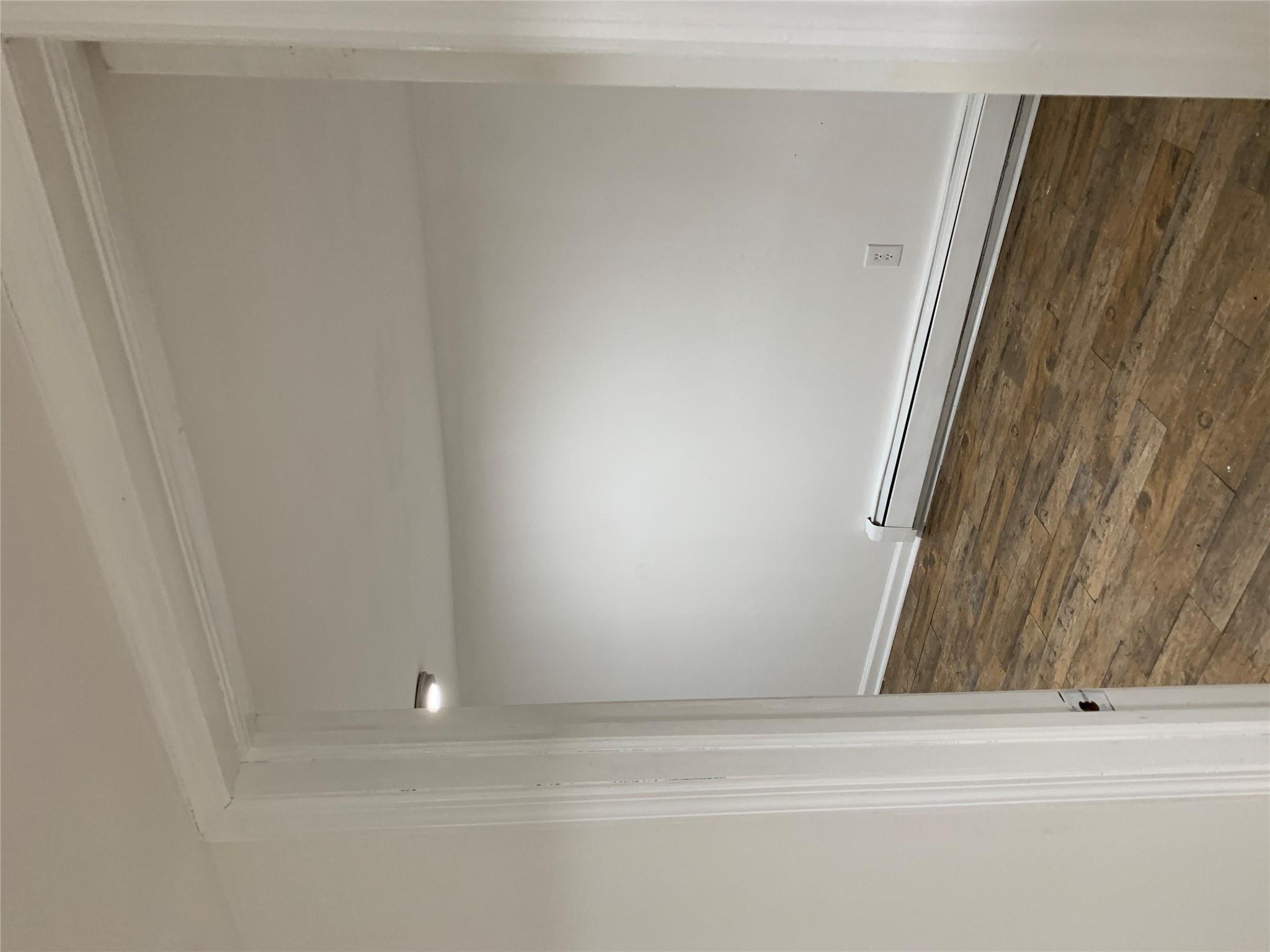 2263 Ryer Avenue Bronx, NY 10457 - Photo 35 of 49 Empty room featuring hardwood / wood-style floors and a baseboard radiator