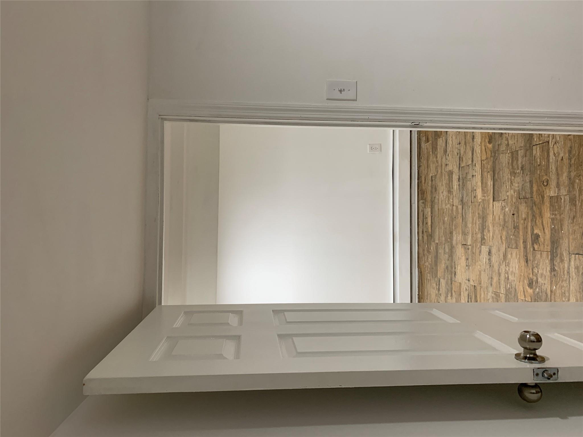 2263 Ryer Avenue Bronx, NY 10457 - Photo 40 of 49 Corridor featuring wood finished floors and a baseboard heating unit