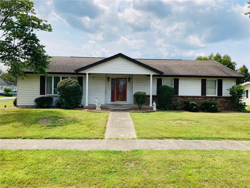 4 Edwards Street Altamont, IL 62411 - Photo 1 of 1 a front view of a house with a yard and garage