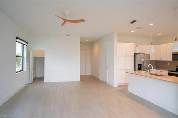 a view of kitchen with furniture and wooden floor