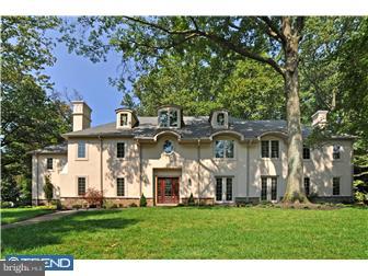 449 West Valley Road Wayne, PA 19087 - Photo 1 of 12 a view of a white house with a big yard and large trees