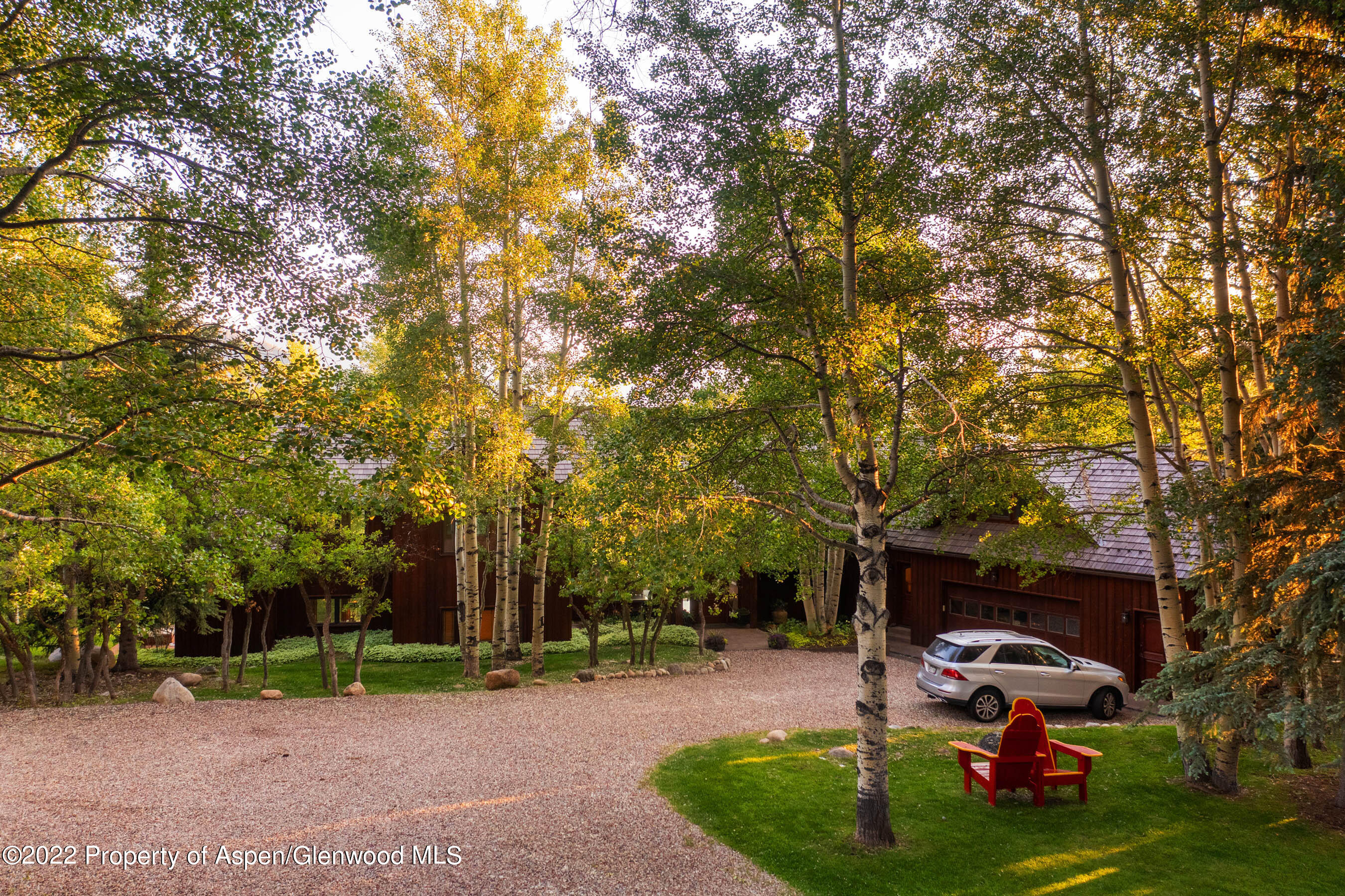 346 East Reds Road Aspen, CO 81612 - Photo 24 of 41 a view of a patio with table and chairs under an umbrella