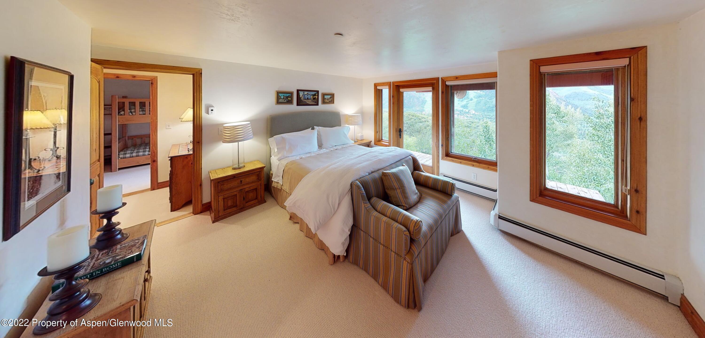 346 East Reds Road Aspen, CO 81612 - Photo 29 of 41 a bedroom with a bed and a large window