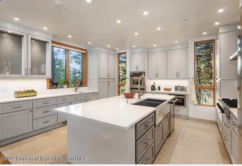 346 East Reds Road Aspen, CO 81612 - Photo 3 of 41 a kitchen with a sink stove and cabinets