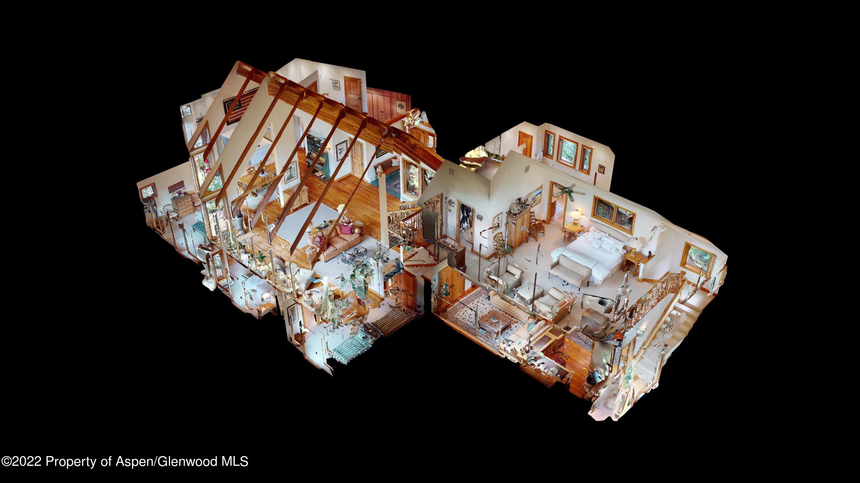 346 East Reds Road Aspen, CO 81612 - Photo 41 of 41 a bed sitting in a bedroom next to a lamp