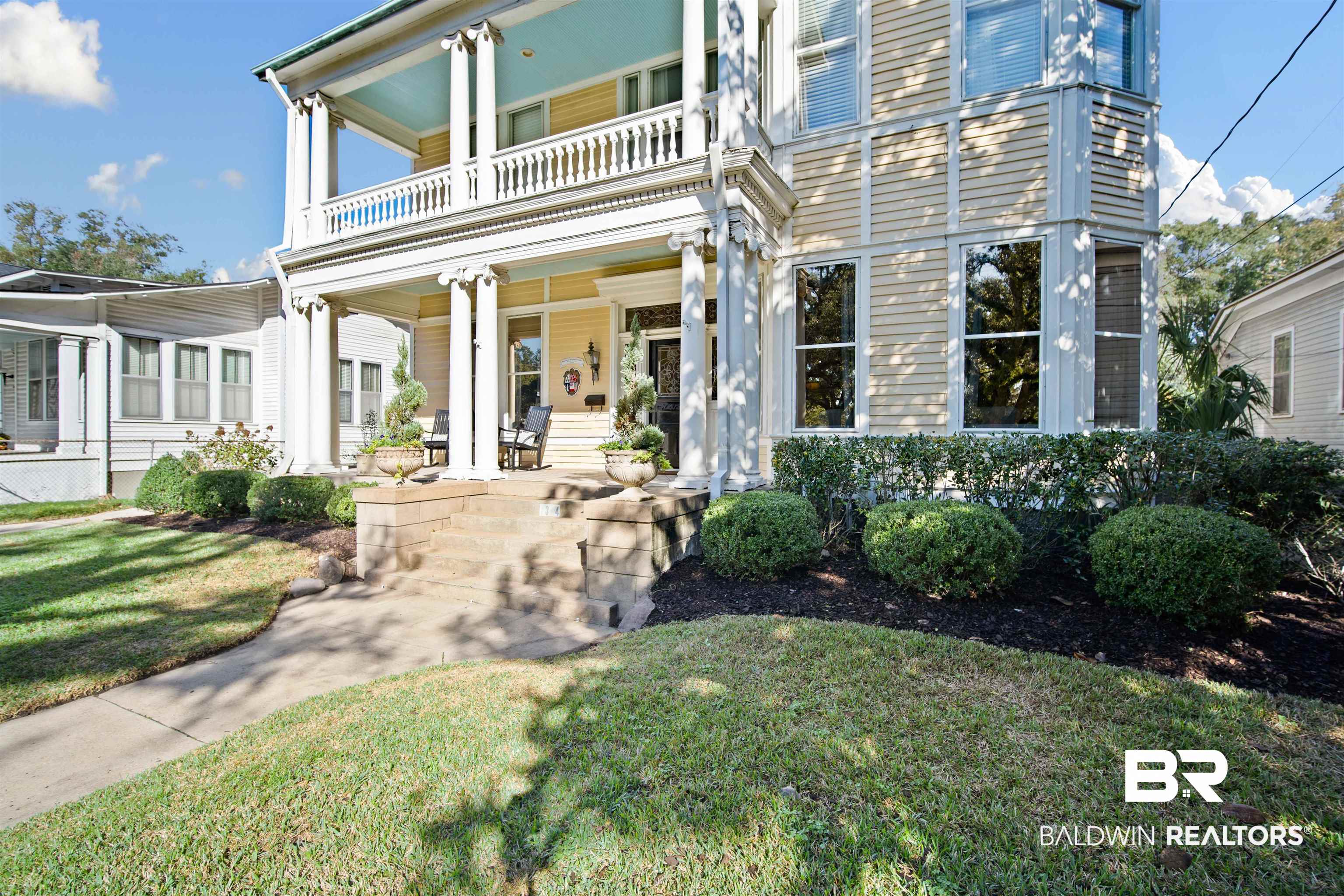 1314 Dauphin Street Mobile, AL 36604 - Photo 3 of 61 View of front facade featuring covered porch, a balcony, and a front yard