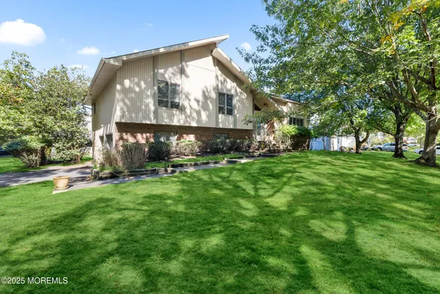 a view of backyard with a garden and entertaining space