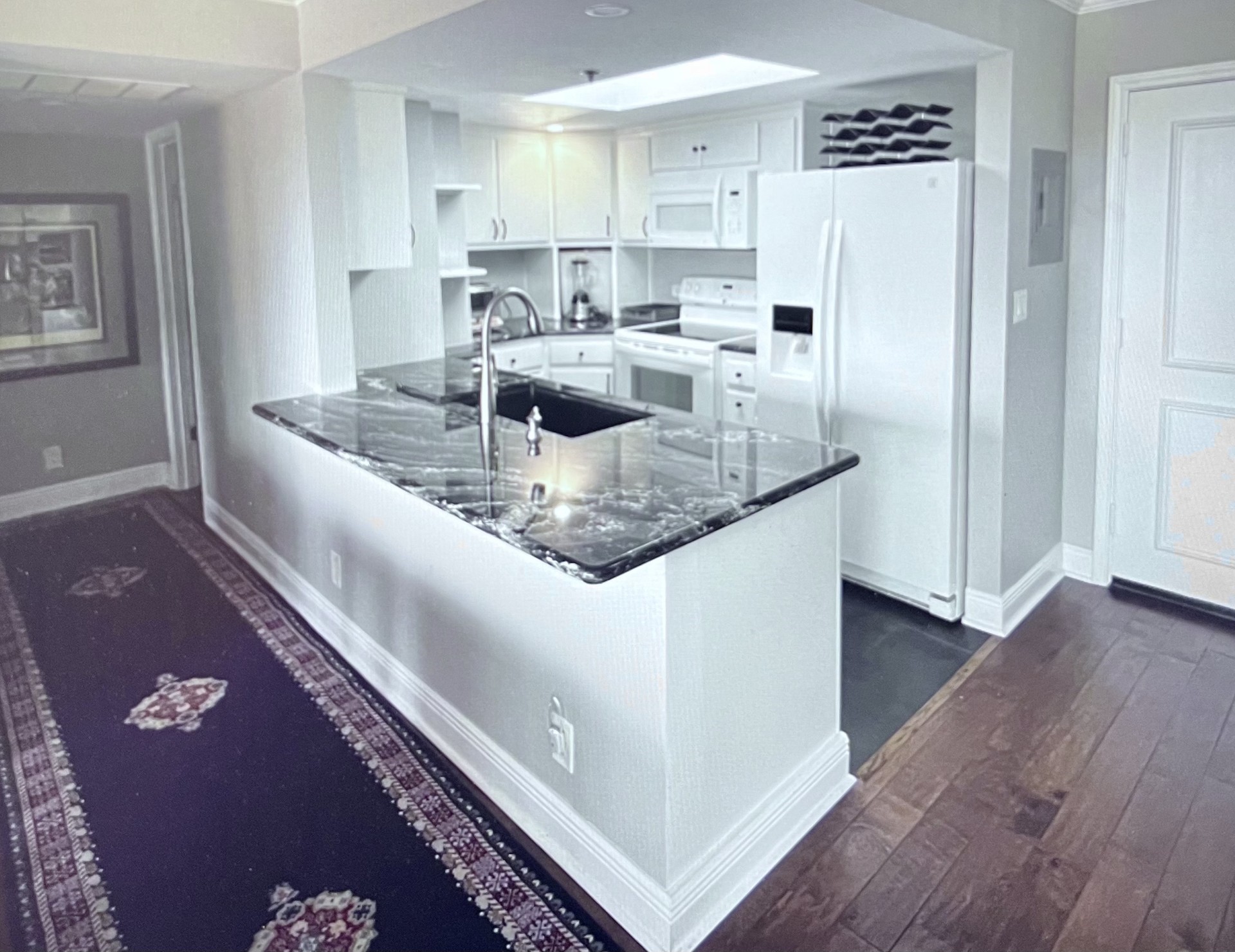 3525 Sage Road, Unit 402 Houston, TX 77056 - Photo 7 of 39 a kitchen with stainless steel appliances granite countertop a sink refrigerator and cabinets