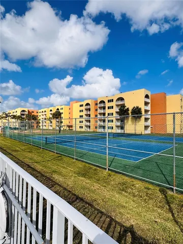 a view of a balcony with an ocean