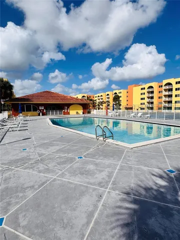 a view of a fountain in front of a house