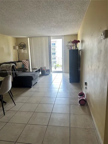 a living room with fireplace and a table