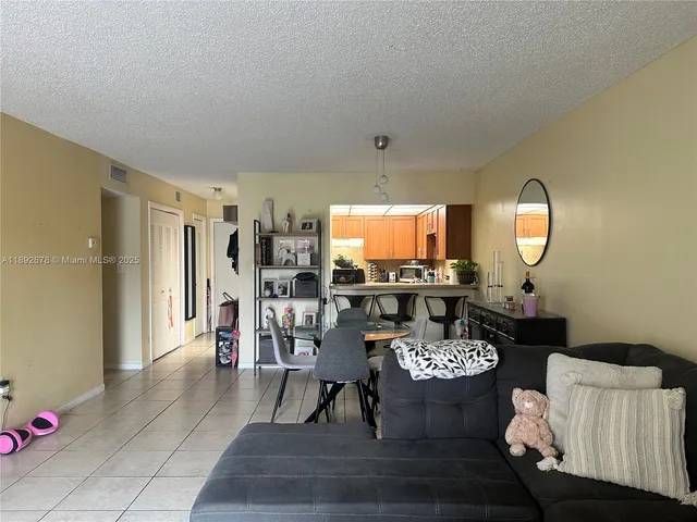 a kitchen with a stove and a refrigerator