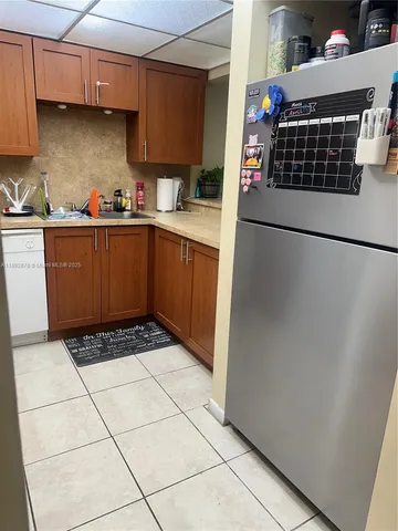 a kitchen with a cabinets a stove top oven and cabinets