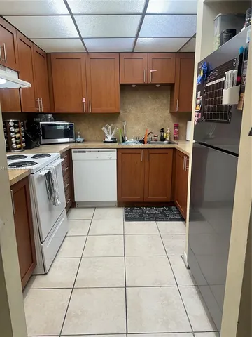 a bathroom with a sink vanity and toilet