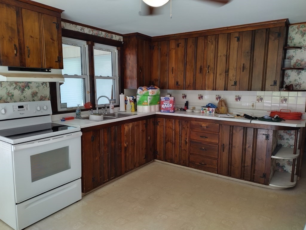 116 County Road Southampton, MA 01073 - Photo 12 of 18 a kitchen with a sink stove and cabinets
