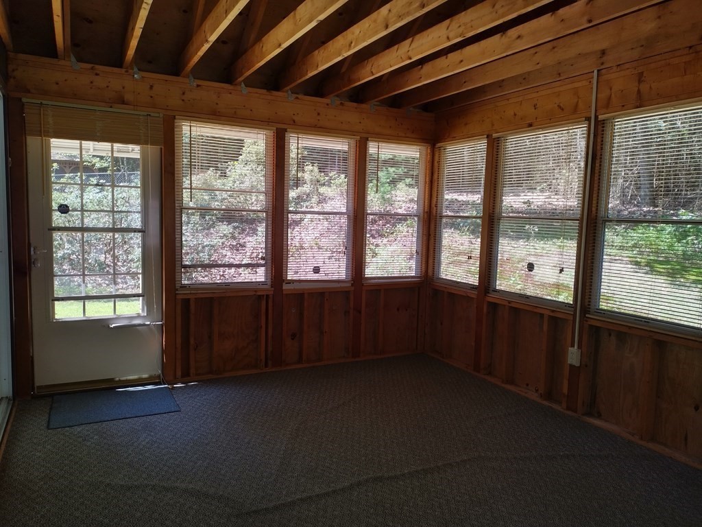 116 County Road Southampton, MA 01073 - Photo 9 of 18 a living room with hardwood furniture and a large window